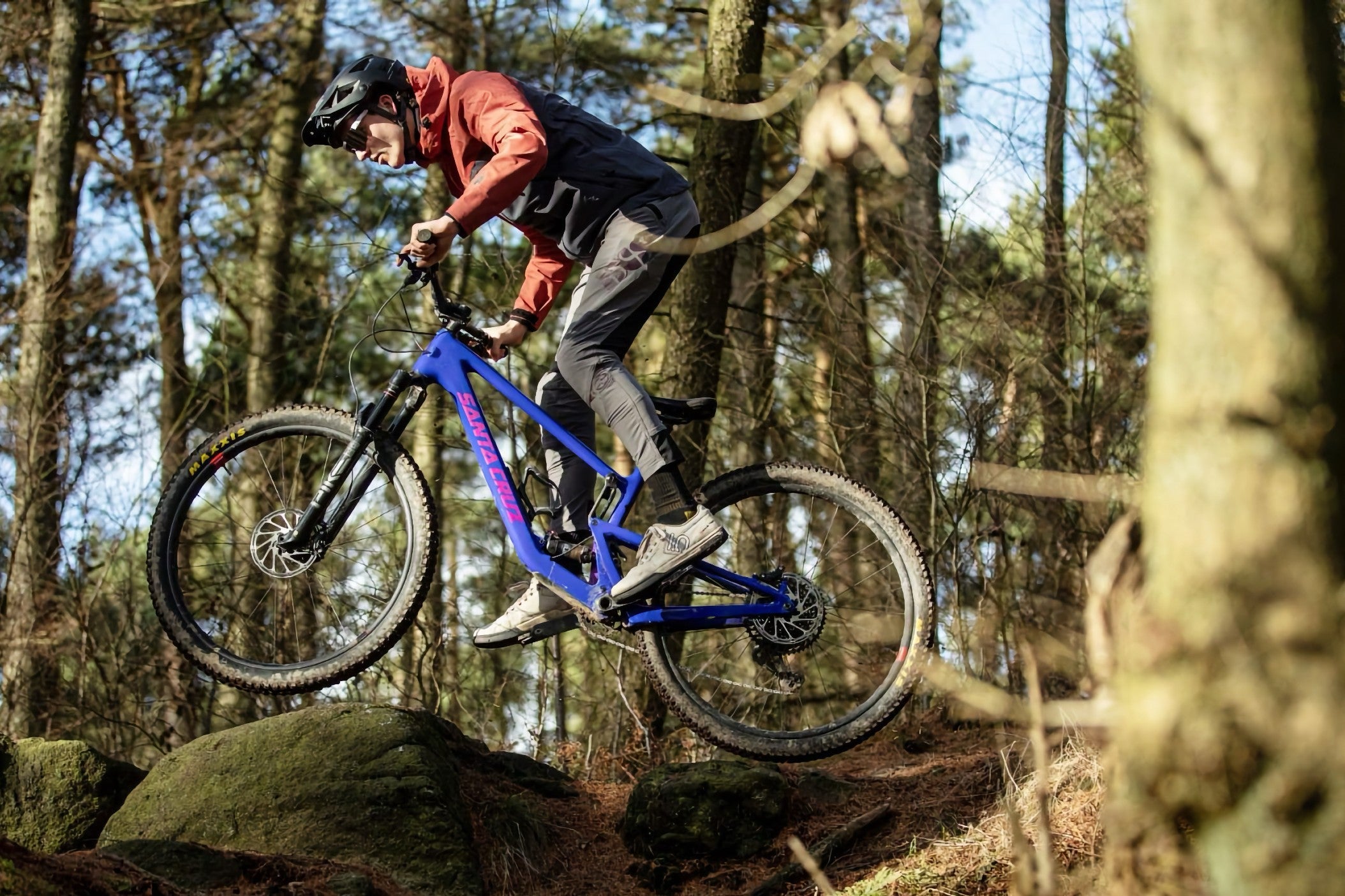 Mick Kirkman airborne on his Santa Cruz Tallboy on a rocky woodland trail. Photo: MBR