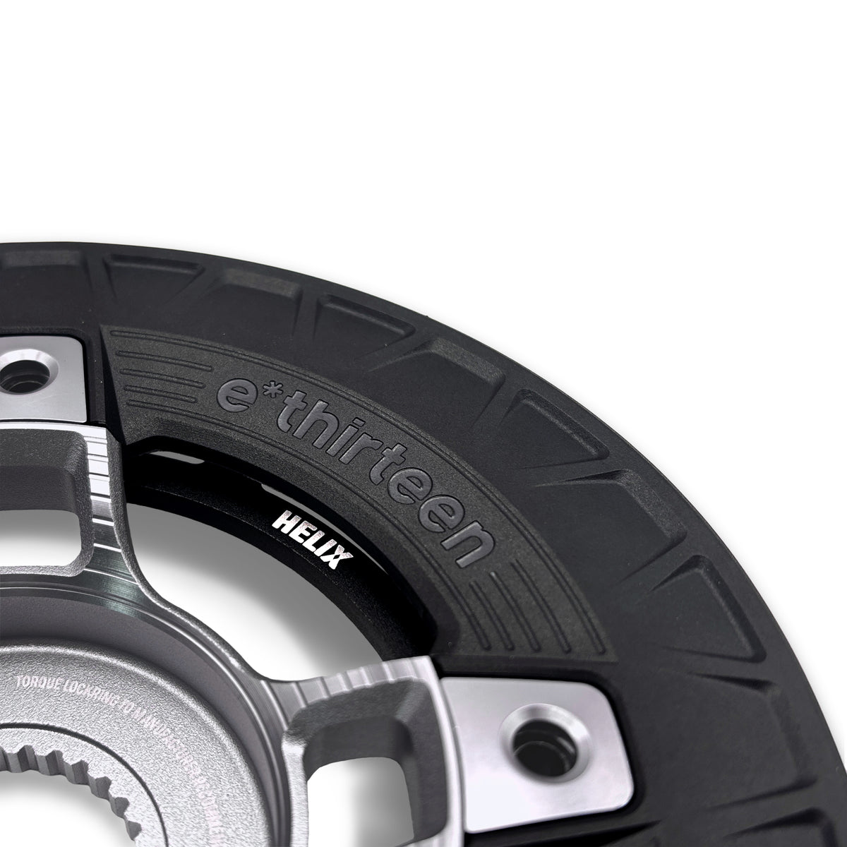 Front detail of the Turbocharger spider and Helix chainring, the e*thirteen and Helix marks on the composite bashguard.