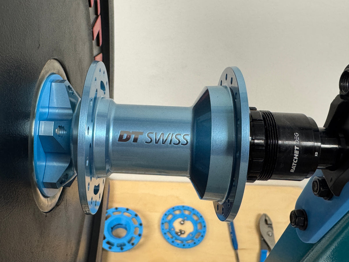A DT Swiss hub mounted on the weighted plate for the spin-down test.