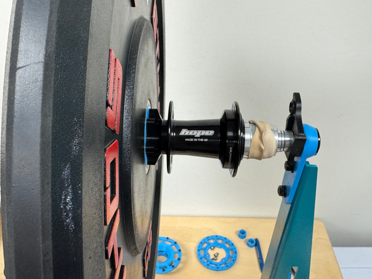 A Hope Pro 5 hub mounted on the weighted plate for the spin-down test.