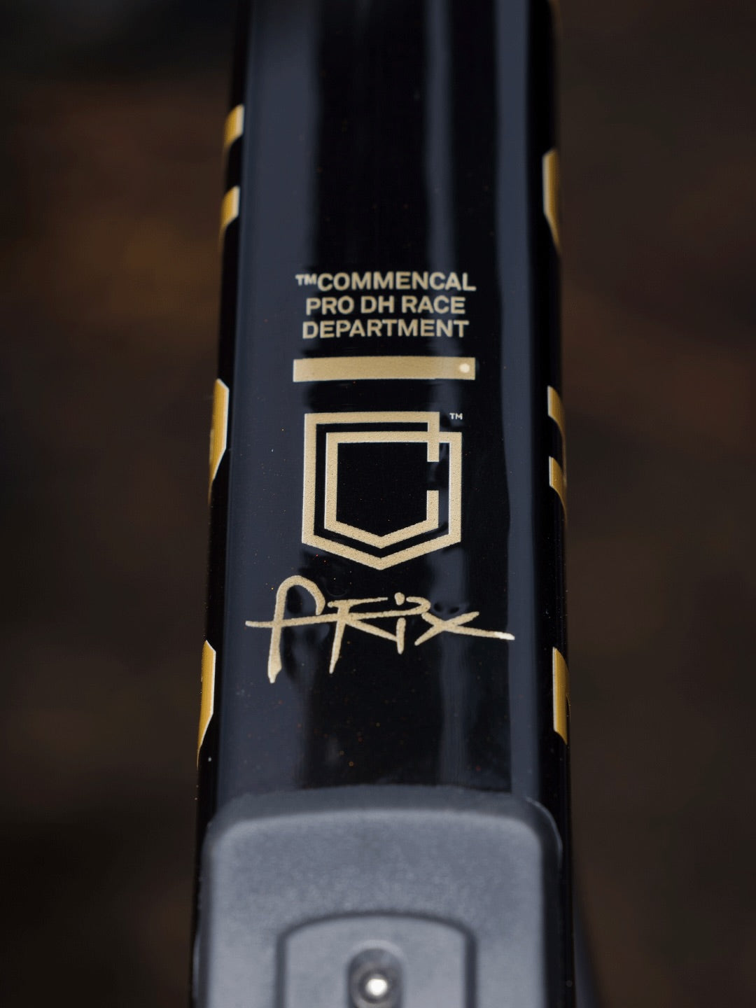 The Commencal Pro DH Race Department down tube on Hugo Frixtalon's Supreme, carrying his signature
