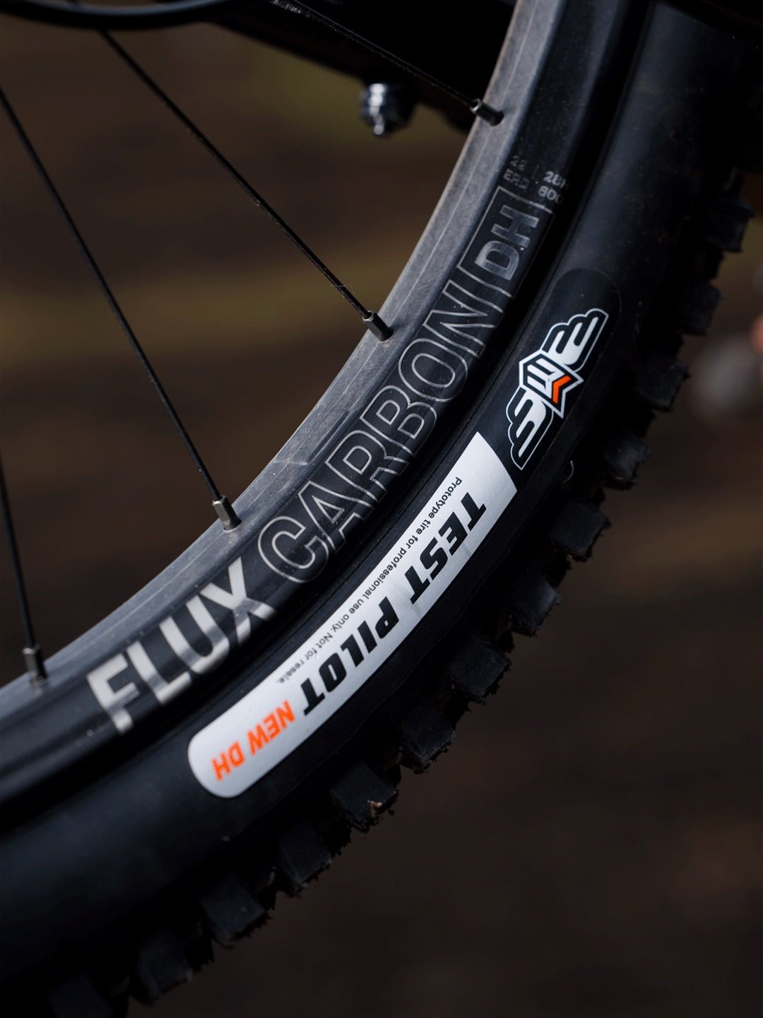 A Sidekick Flux Carbon DH rim and Maxxis tire on Hugo Frixtalon's Supreme DH