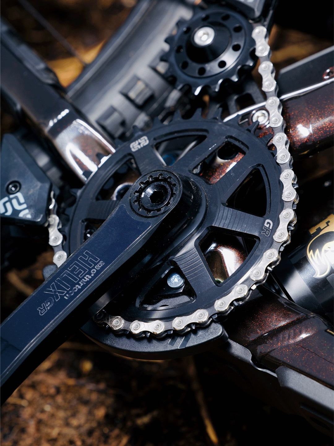 Close up of a Helix Race Alloy GR crank arm and GR chainring on Hugo Frixtalon's Supreme DH