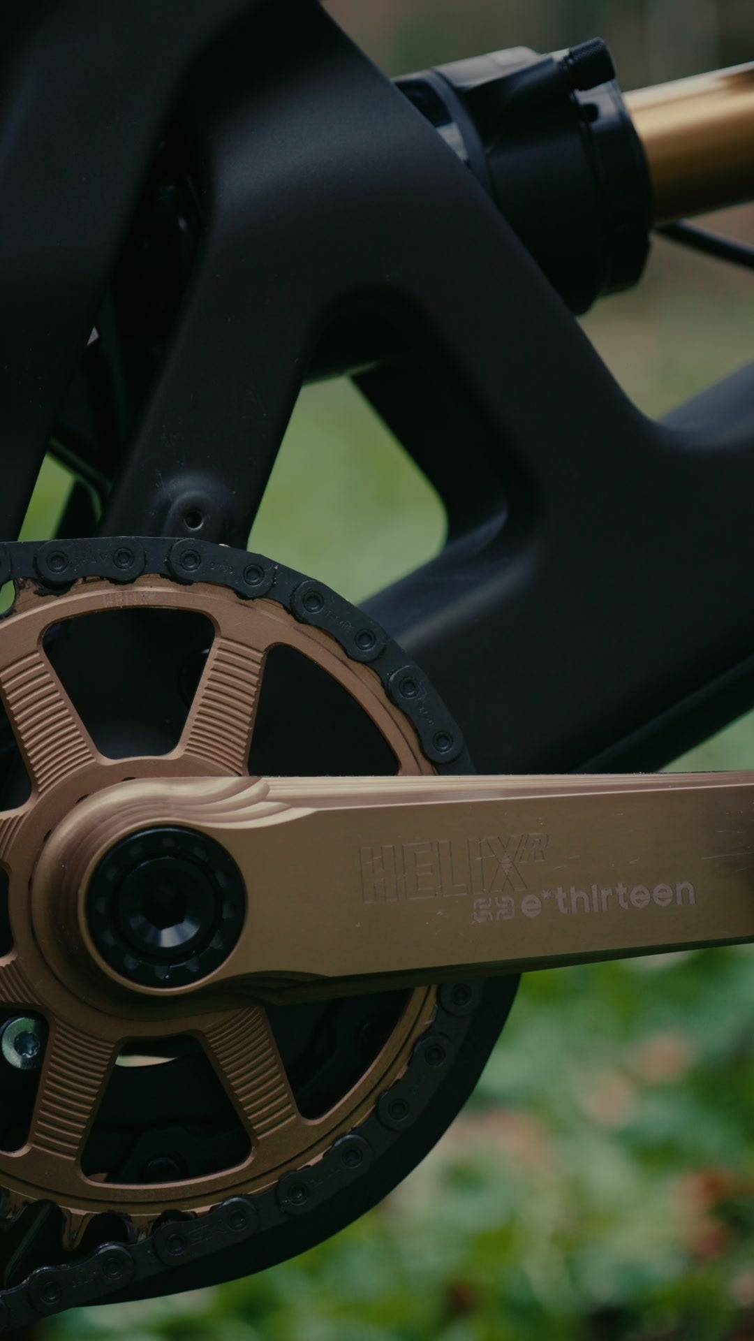 Close up of a bronze Helix Race alloy crank arm and direct mount chainring on Jasper Jauche's Nomad