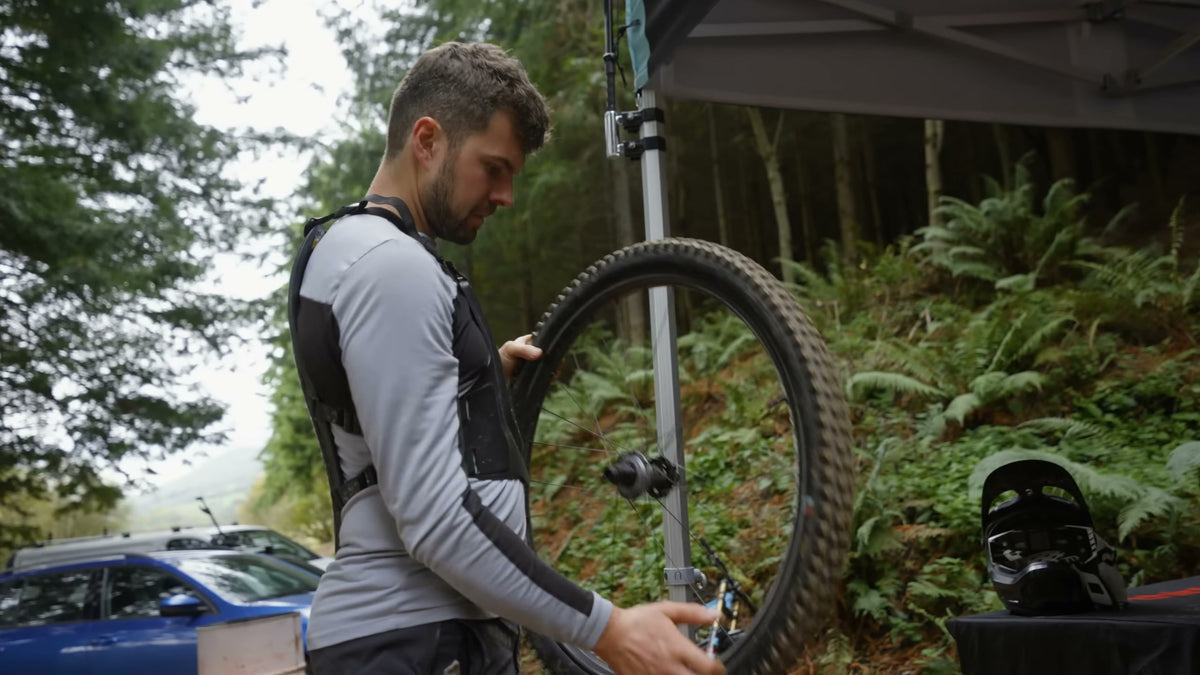 A rider carrying a Sidekick wheel back to his own bike.